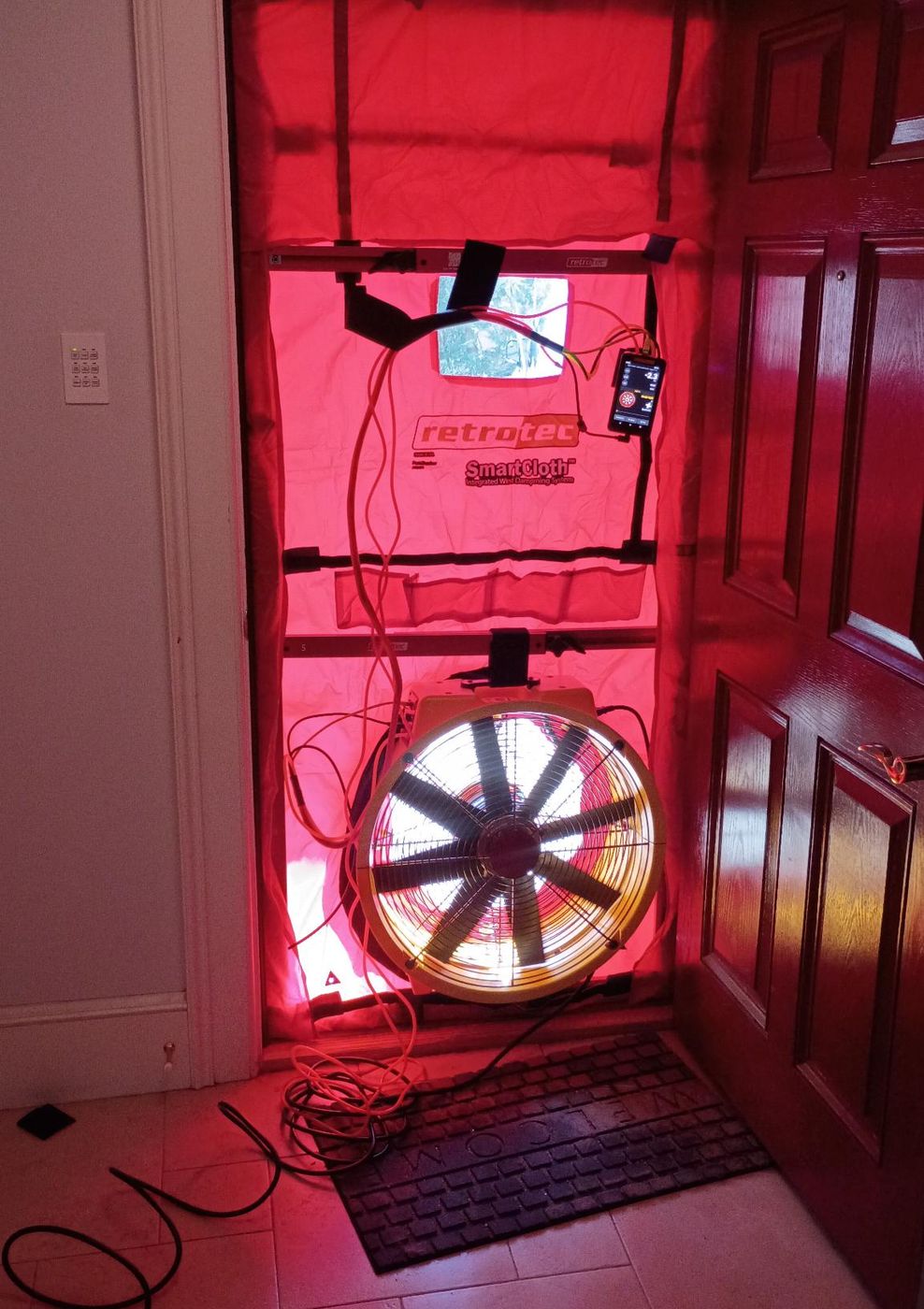 Blower door test for building science assessment