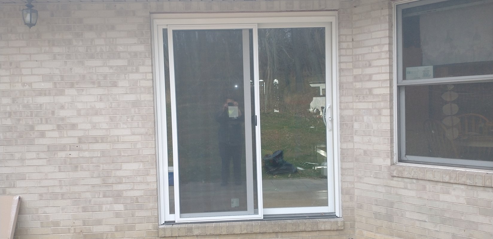 Sliding Glass Door Installed On Brick Wall