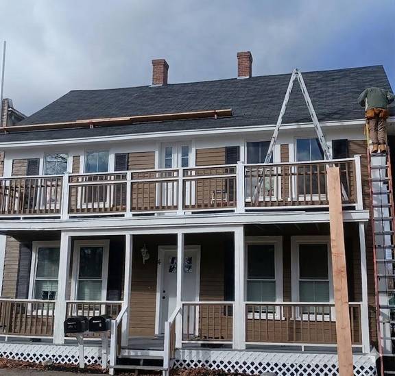 Atlas team member working on a roofing and exterior project