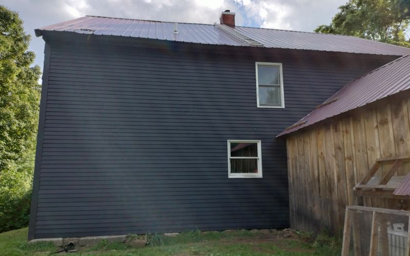 Stained Black Wood Lap Siding