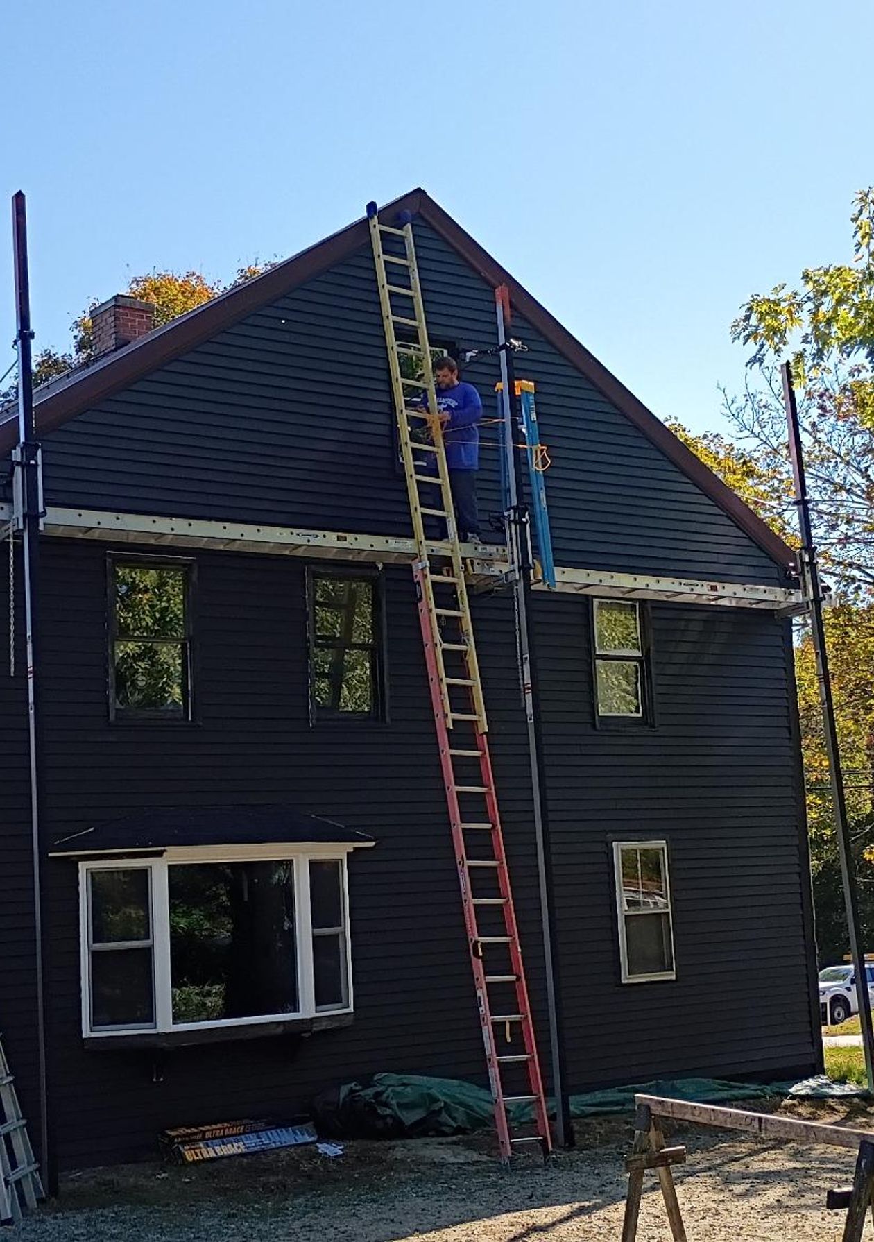 Atlas team standing together outside a completed home project